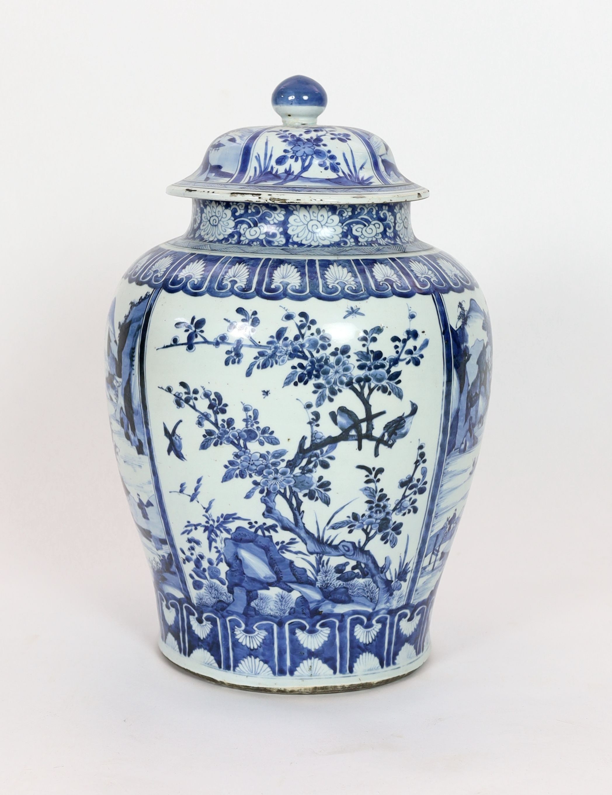 A large Chinese blue and white jar and cover, Kangxi period, 58cm high, Some restored cracks